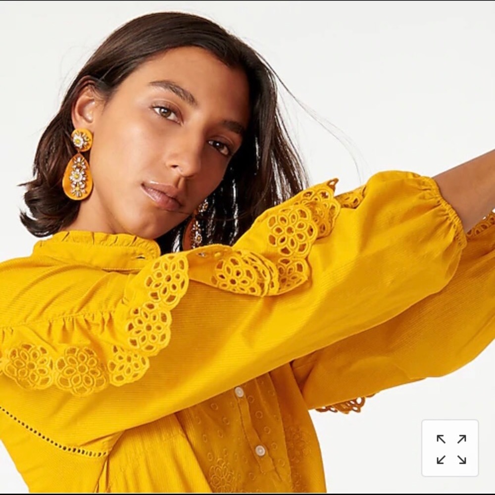 Ruffle-sleeve top with embroidered eyelet